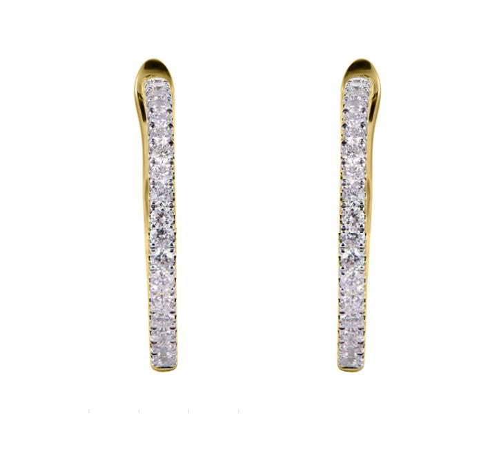 A pair of gold post earrings with a channel-set row of clear cubic zirconia stones, shown against a plain white background.