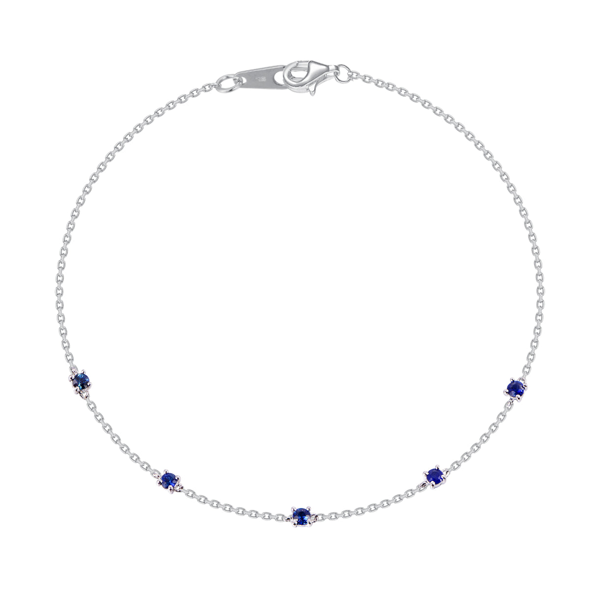 14K white gold station bracelet featuring round blue sapphires evenly spaced along a delicate chai